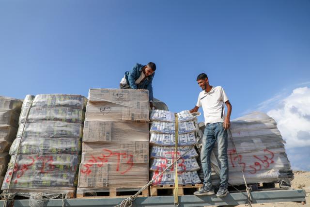(251113) -- GAZA, Nov. 13, 2025 (Xinhua) -- Photo taken on Nov. 13, 2025 shows commercial goods that has entered through the Zikim crossing in northern Gaza Strip. Israel said on Wednesday it has reopened the Zikim crossing to allow humanitarian aid trucks into northern Gaza. (Photo by Rizek Abdeljawad/Xinhua)