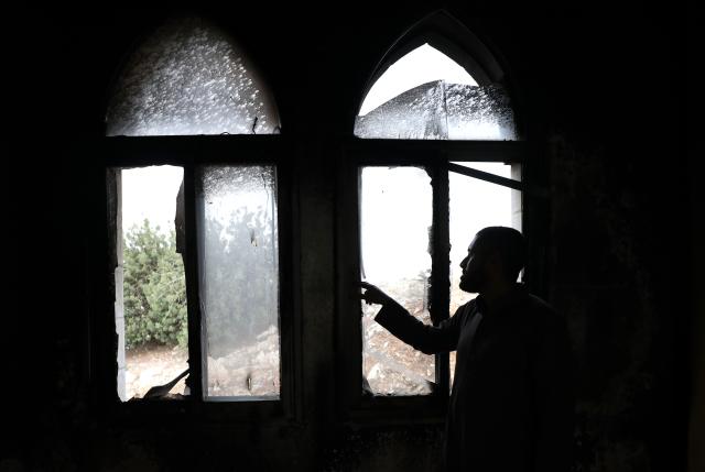 (251113) -- RAMALLAH, Nov. 13, 2025 (Xinhua) -- A Palestinian inspects the aftermath of the fire at the "Hajjah Hamidah" mosque in the town of Deir Istiya, northwest of Salfit in the West Bank, Nov. 13, 2025. Israeli settlers set fire to parts of a mosque northwest of Salfit in the West Bank on Thursday and wrote anti-Islam slogans on its walls, the Palestinian Liberation Organization's Commission Against the Wall and Settlements said in a brief statement. (Photo by Nidal Eshtayeh/Xinhua)