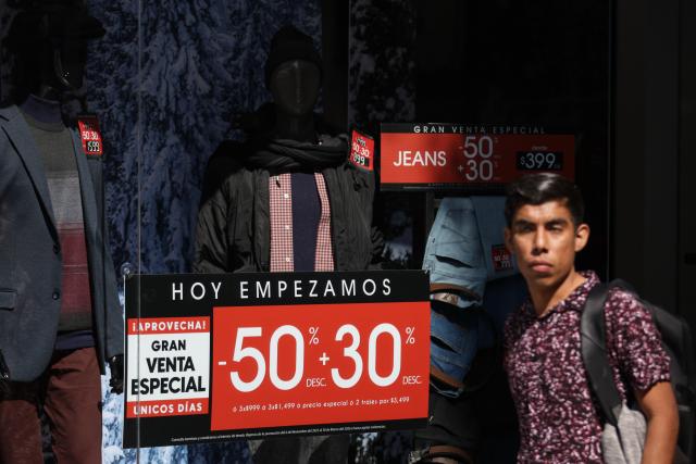 (251113) -- MEXICO CITY, Nov. 13, 2025 (Xinhua) -- A man walks past a store at the first day of the special sales event known as "El Buen Fin," in Mexico City, capital of Mexico, Nov. 13, 2025. (Xinhua/Francisco Canedo)