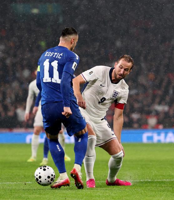 (251114) -- LONDON, Nov. 14, 2025 (Xinhua) -- England's Harry Kane (R) vies with Serbia's Filip Kostic during the World Cup 2026 European Qualifiers group K football match between England and Serbia in London, Britain, Nov. 13, 2025. (Xinhua/Li Ying)