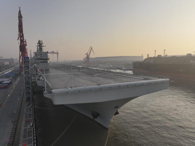(251114) -- SHANGHAI, Nov. 14, 2025 (Xinhua) -- China's first Type 076 amphibious assault ship, PLANS Sichuan, sets sail from the port of Hudong-Zhonghua Shipbuilding (Group) Co., Ltd. in east China's Shanghai, Nov. 14, 2025.
  PLANS Sichuan set sail from Shanghai on Friday morning to conduct its first navigation test mission. The sea trial will focus on testing and verifying the reliability and stability of the ship's power, electrical and other systems. (Photo by Zhang Liang/Xinhua)