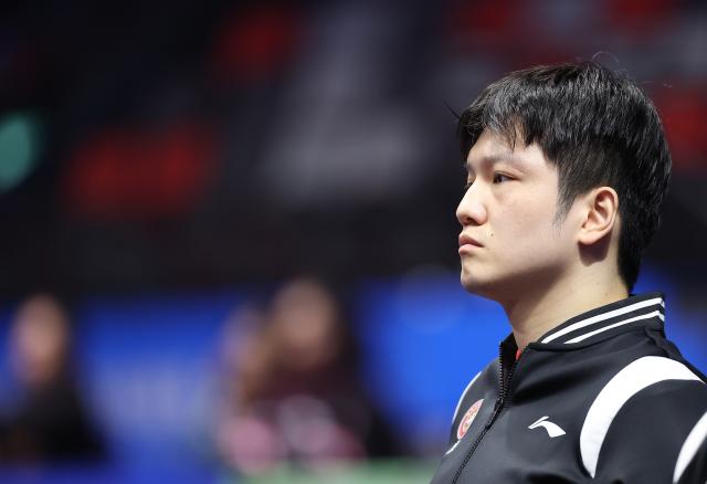(251114) -- MACAO, Nov. 14, 2025 (Xinhua) -- Fan Zhendong of Shanghai watches his teammates competing during the men's team group A match of table tennis between Shanghai and Jiangsu at China's 15th National Games in Macao, south China, Nov. 14, 2025. (Xinhua/Liang Xu)