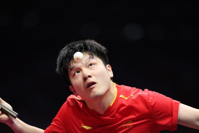 (251114) -- MACAO, Nov. 14, 2025 (Xinhua) -- Fan Zhendong of Shanghai serves in a match against Sun Wen of Jiangsu during the men's team group A match of table tennis between Shanghai and Jiangsu at China's 15th National Games in Macao, south China, Nov. 14, 2025. (Xinhua/Liang Xu)