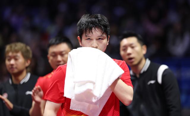 (251114) -- MACAO, Nov. 14, 2025 (Xinhua) -- Fan Zhendong of Shanghai reacts in a match against Sun Wen of Jiangsu during the men's team group A match of table tennis between Shanghai and Jiangsu at China's 15th National Games in Macao, south China, Nov. 14, 2025. (Xinhua/Liang Xu)