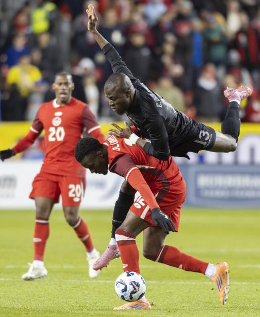 (251114) -- TORONTO, Nov. 14, 2025 (Xinhua) -- Tani Oluwaseyi (bottom) of Canada vies with Enner Valencia Lastra of Ecuador during a friendly football match between Canada and Ecuador at BMO Field in Toronto, Canada, on Nov. 13, 2025. (Photo by Zou Zheng/Xinhua)