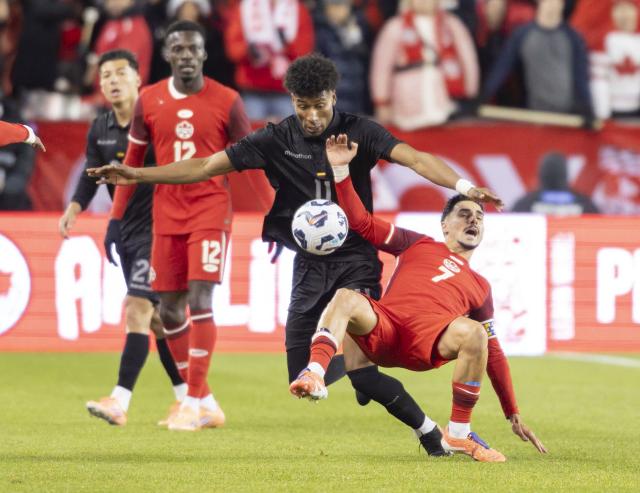 (251114) -- TORONTO, Nov. 14, 2025 (Xinhua) -- Stephen Eustaquio (front R) of Canada vies with Kevin Rodriguez Cortez (front L) of Ecuador during a friendly football match between Canada and Ecuador at BMO Field in Toronto, Canada, on Nov. 13, 2025. (Photo by Zou Zheng/Xinhua)