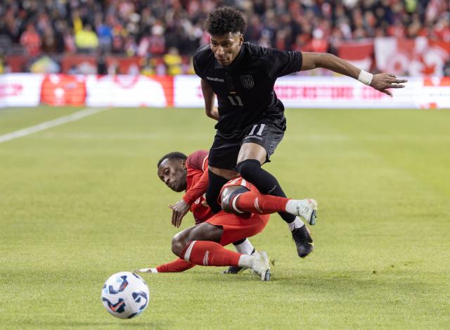 (251114) -- TORONTO, Nov. 14, 2025 (Xinhua) -- Richie Laryea (bottom) of Canada vies with Kevin Rodriguez Cortez of Ecuador during a friendly football match between Canada and Ecuador at BMO Field in Toronto, Canada, on Nov. 13, 2025. (Photo by Zou Zheng/Xinhua)
