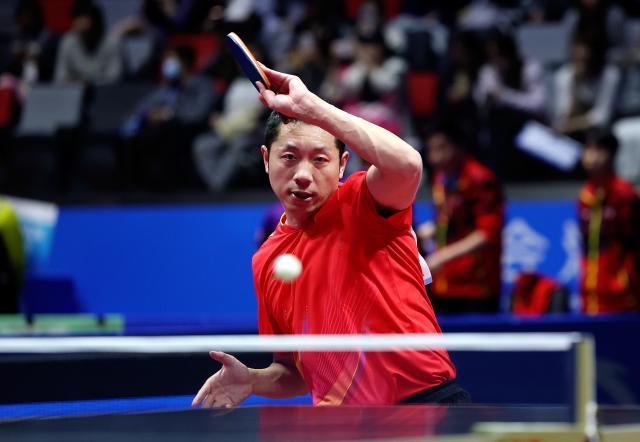 (251114) -- MACAO, Nov. 14, 2025 (Xinhua) -- Xu Xin of Shanghai returns a ball in the match against Chen Yaxuan of Jiangsu during the men's team group A match of table tennis between Shanghai and Jiangsu at China's 15th National Games in Macao, south China, Nov. 14, 2025. (Xinhua/Sun Fanyue)