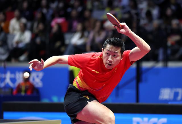 (251114) -- MACAO, Nov. 14, 2025 (Xinhua) -- Xu Xin of Shanghai returns a ball in the match against Chen Yaxuan of Jiangsu during the men's team group A match of table tennis between Shanghai and Jiangsu at China's 15th National Games in Macao, south China, Nov. 14, 2025. (Xinhua/Sun Fanyue)