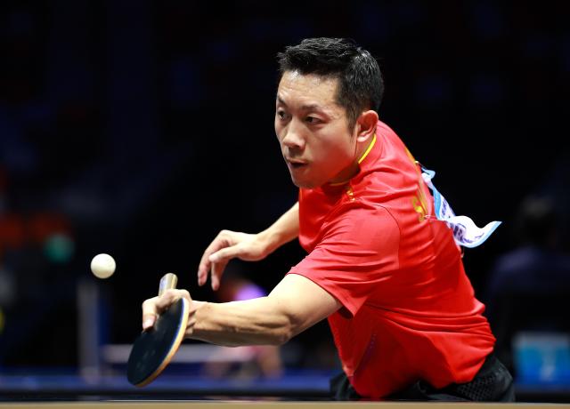 (251114) -- MACAO, Nov. 14, 2025 (Xinhua) -- Xu Xin of Shanghai returns a ball in the match against Chen Yaxuan of Jiangsu during the men's team group A match of table tennis between Shanghai and Jiangsu at China's 15th National Games in Macao, south China, Nov. 14, 2025. (Xinhua/Liang Xu)