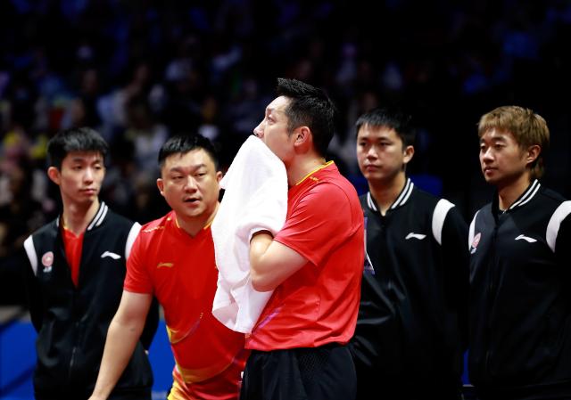 (251114) -- MACAO, Nov. 14, 2025 (Xinhua) -- Xu Xin of Shanghai reacts in the match against Chen Yaxuan of Jiangsu during the men's team group A match of table tennis between Shanghai and Jiangsu at China's 15th National Games in Macao, south China, Nov. 14, 2025. (Xinhua/Liang Xu)