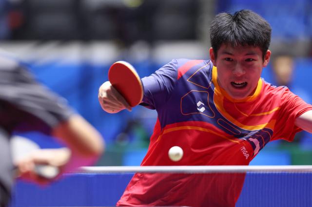 (251114) -- MACAO, Nov. 14, 2025 (Xinhua) -- Wen Ruibo of Henan hits a return during the U18 men's singles semifinal match of table tennis between Wen Ruibo of Hennan and Huang Youhao of Beijing at China's 15th National Games in Macao, south China, Nov. 14, 2025. (Xinhua/Sun Fanyue)