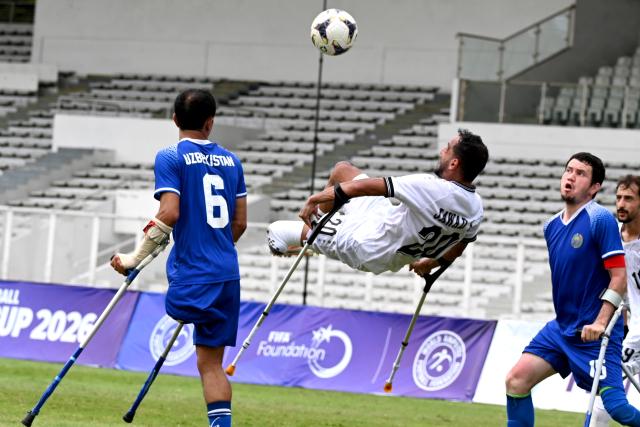 (251114) -- JAKARTA, Nov. 14, 2025 (Xinhua) -- Jawad Kadhim Jawad Al-Janabi (2nd L) of Iraq competes during the match between Uzbekistan and Iraq at the Asian Amputee Football Cup Qualifiers 2025 in Jakarta, Indonesia, Nov. 14, 2025. (Xinhua/Agung Kuncahya B.)