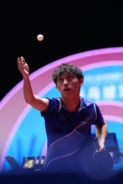(251114) -- MACAO, Nov. 14, 2025 (Xinhua) -- Zhou Jinquan of Shanghai serves during the U18 men's singles semifinal match of table tennis between Zhou Jinquan of Shanghai and Chen Xuanyi of Hebei at China's 15th National Games in Macao, south China, Nov. 14, 2025. (Xinhua/Liang Xu)