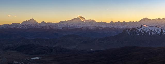 (251114) -- TINGRI, Nov. 14, 2025 (Xinhua) -- A drone photo taken on Nov. 13, 2025 shows a dusk view of Mount Lhotse, Mount Qomolangma, and Mount Cho Oyu (L to R) in Tingri County of Xigaze, southwest China's Xizang Autonomous Region. (Xinhua/Jiang Fan)
