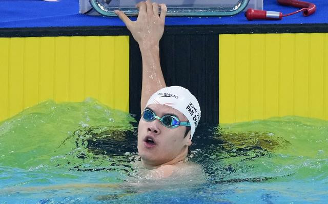 (251114) -- SHENZHEN, Nov. 14, 2025 (Xinhua) -- Pan Zhanle of Zhejiang reacts after the men's 100m freestyle final of swimming at China's 15th National Games in Shenzhen, south China's Guangdong Province, Nov. 14, 2025. (Xinhua/Du Yu)
