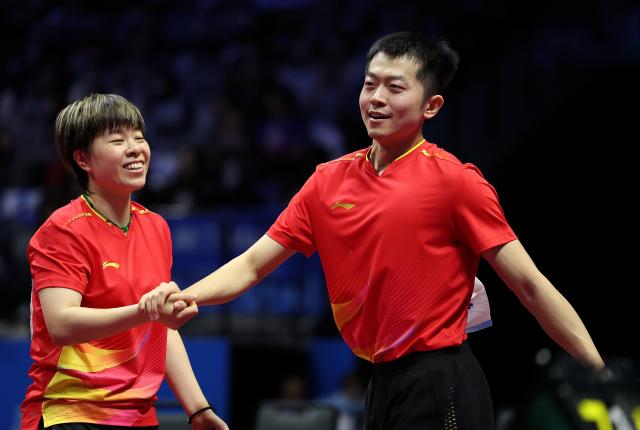 (251114) -- MACAO, Nov. 14, 2025 (Xinhua) -- Wang Yidi/Yuan Licen (R) celebrate winning the mixed doubles bronze medal match of table tennis between Chen Xingtong/Xu Haidong of Liaoning and Wang Yidi/Yuan Licen of Liaoning at China's 15th National Games in Macao, south China, Nov. 14, 2025. (Xinhua/Sun Fanyue)
