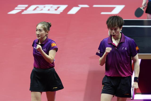 (251114) -- MACAO, Nov. 14, 2025 (Xinhua) -- Lin Gaoyuan (R)/Liu Shiwen celebrate scoring during the mixed doubles final of table tennis between Chen Yuanyu/Kuai Man of Jiangsu and Lin Gaoyuan/Liu Shiwen of Guangdong at China's 15th National Games in Macao, south China, Nov. 14, 2025. (Xinhua/Liang Xu)