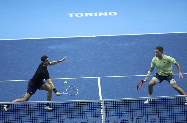 (251115) -- TURIN, Nov. 15, 2025 (Xinhua) -- Joe Salisbury/Neal Skupski (R) compete during the men's doubles round robin match between Christian Harrison/Evan King of the United States and Joe Salisbury/Neal Skupski of Britain at the ATP Finals tennis tournament in Turin, Italy, on Nov. 14, 2025. (Xinhua/Li Jing)