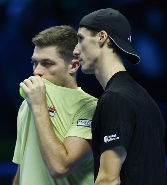 (251115) -- TURIN, Nov. 15, 2025 (Xinhua) -- Joe Salisbury/Neal Skupski (L) react during the men's doubles round robin match between Christian Harrison/Evan King of the United States and Joe Salisbury/Neal Skupski of Britain at the ATP Finals tennis tournament in Turin, Italy, on Nov. 14, 2025. (Xinhua/Li Jing)