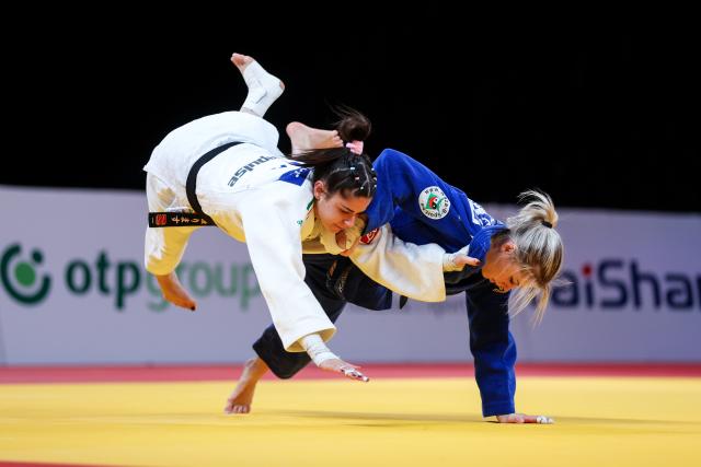 (251115) -- ZAGREB, Nov. 15, 2025 (Xinhua) -- Giulia Ghiglione (L) of Italy competes against Lois Petit of Belgium during the women's -48kg bronze medal match at the IJF Judo Zagreb Grand Prix 2025 in Zagreb, Croatia, Nov. 14, 2025. (Igor Kralj/PIXSELL via Xinhua)