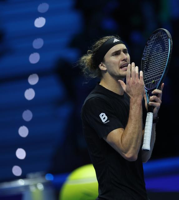 (251115) -- TURIN, Nov. 15, 2025 (Xinhua) -- Alexander Zverev reacts after losing a point during the men's singles round robin match between Alexander Zverev of Germany and Felix Auger-Aliassime of Canada at the ATP Finals tennis tournament in Turin, Italy, on Nov. 14, 2025. (Xinhua/Li Jing)