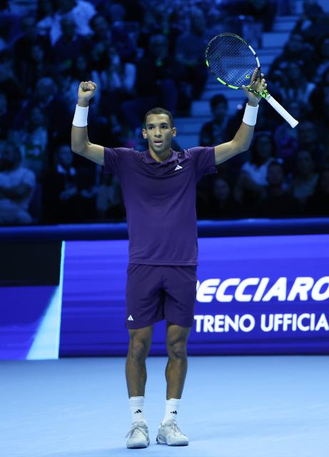 (251115) -- TURIN, Nov. 15, 2025 (Xinhua) -- Felix Auger-Aliassime celebrates after winning the men's singles round robin match between Alexander Zverev of Germany and Felix Auger-Aliassime of Canada at the ATP Finals tennis tournament in Turin, Italy, on Nov. 14, 2025. (Xinhua/Li Jing)