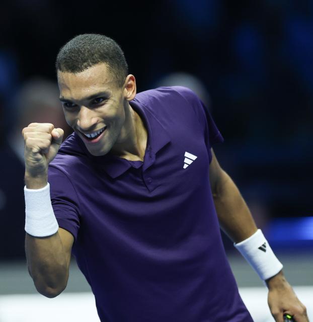 (251115) -- TURIN, Nov. 15, 2025 (Xinhua) -- Felix Auger-Aliassime celebrates after winning the men's singles round robin match between Alexander Zverev of Germany and Felix Auger-Aliassime of Canada at the ATP Finals tennis tournament in Turin, Italy, on Nov. 14, 2025. (Xinhua/Li Jing)