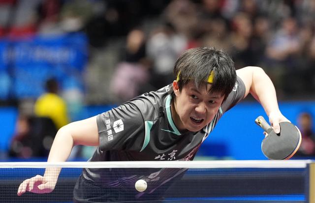 (251115) -- MACAO, Nov. 15, 2025 (Xinhua) -- Wang Chuqin serves during the men's singles semifinal match of table tennis between Fan Zhendong of Shanghai and Wang Chuqin of Beijing at China's 15th National Games in Macao, south China, Nov. 15, 2025. (Xinhua/Zhou Mi)