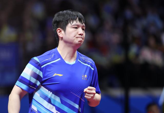 (251115) -- MACAO, Nov. 15, 2025 (Xinhua) -- Fan Zhendong reacts during the men's singles semifinal match of table tennis between Fan Zhendong of Shanghai and Wang Chuqin of Beijing at China's 15th National Games in Macao, south China, Nov. 15, 2025. (Xinhua/Liu Xu)