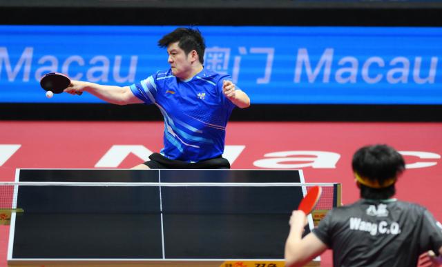 (251115) -- MACAO, Nov. 15, 2025 (Xinhua) -- Fan Zhendong (L) hits a return during the men's singles semifinal match of table tennis between Fan Zhendong of Shanghai and Wang Chuqin of Beijing at China's 15th National Games in Macao, south China, Nov. 15, 2025. (Xinhua/Cheong Kam Ka)