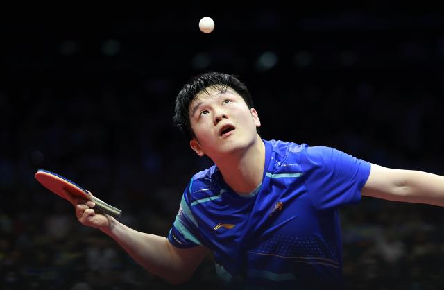 (251115) -- MACAO, Nov. 15, 2025 (Xinhua) -- Fan Zhendong serves during the men's singles semifinal match of table tennis between Fan Zhendong of Shanghai and Wang Chuqin of Beijing at China's 15th National Games in Macao, south China, Nov. 15, 2025. (Xinhua/Liang Xu)