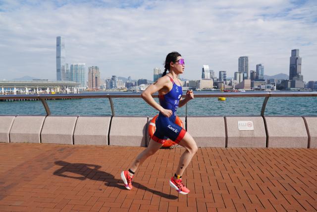 (251115) -- HONG KONG, Nov. 15, 2025 (Xinhua) -- Huang Anqi of Gongan competes during the women's individual triathlon at China's 15th National Games in Hong Kong, south China, Nov. 15, 2025. (Photo by Wang Shen/Xinhua)