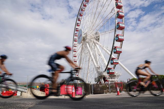 (251115) -- HONG KONG, Nov. 15, 2025 (Xinhua) -- Athletes compete during the women's individual triathlon at China's 15th National Games in Hong Kong, south China, Nov. 15, 2025. (Photo by Wang Shen/Xinhua)