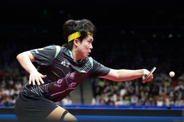 (251115) -- MACAO, Nov. 15, 2025 (Xinhua) -- Wang Chuqin hits a return during the men's singles semifinal match of table tennis between Fan Zhendong of Shanghai and Wang Chuqin of Beijing at China's 15th National Games in Macao, south China, Nov. 15, 2025. (Xinhua/Liang Xu)