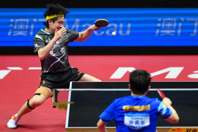 (251115) -- MACAO, Nov. 15, 2025 (Xinhua) -- Wang Chuqin (top) hits a return during the men's singles semifinal match of table tennis between Fan Zhendong of Shanghai and Wang Chuqin of Beijing at China's 15th National Games in Macao, south China, Nov. 15, 2025. (Xinhua/Cheong Kam Ka)