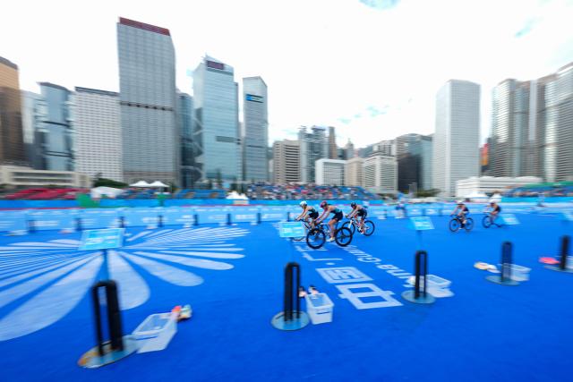 (251115) -- HONG KONG, Nov. 15, 2025 (Xinhua) -- Athletes compete during the women's individual triathlon at China's 15th National Games in Hong Kong, south China, Nov. 15, 2025. (Xinhua/Wu Lu)