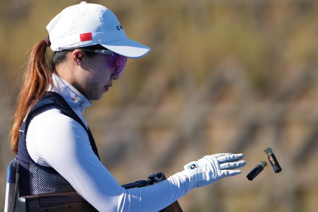 (251115) -- GUANGZHOU, Nov. 15, 2025 (Xinhua) -- Song Zhengyi of Shanghai competes during the skeet mixed team bronze medal match of shooting between Shanghai and Shaanxi at China's 15th National Games in Guangzhou, south China's Guangdong Province, Nov. 15, 2025. (Xinhua/Xiao Ennan)