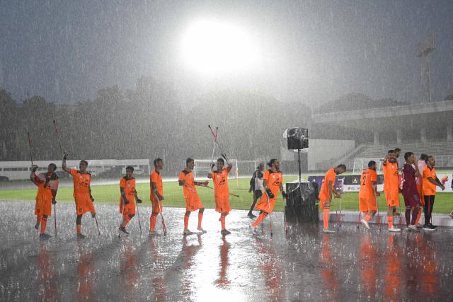 (251115) -- JAKARTA, Nov. 15, 2025 (Xinhua) -- Players of Iran greet supporters before the awarding ceremony after winning the the final match between Uzbekistan and Iran at the Asian Amputee Football Cup Qualifiers 2025 in Jakarta, Indonesia, Nov. 15, 2025. (Xinhua/Agung Kuncahya B.)