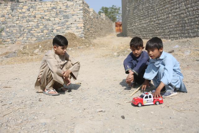 (251115) -- KHOST, Nov. 15, 2025 (Xinhua) -- Bilal Shafiq (L) plays with his friends in Khost province, Afghanistan, Oct. 28, 2025. TO GO WITH: "Feature: China returns heartbeat for Afghan child, thousands more awaiting surgeries" (Photo by Saifurahman Safi/Xinhua)