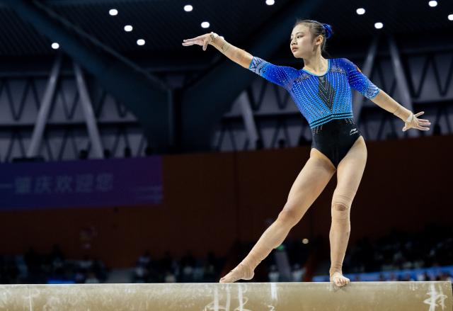 (251115) -- ZHAOQING, Nov. 15, 2025 (Xinhua) -- Qiu Qiyuan of Fujian competes in balance beam during the artistic gymnastics women's individual all-around final at China's 15th National Games in Zhaoqing, south China's Guangdong Province, Nov. 15, 2025. (Xinhua/Du Zixuan)