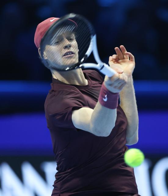 (251116) -- TURIN, Nov. 16, 2025 (Xinhua) -- Jannik Sinner returns a shot during the men's singles semifinal match between Jannik Sinner of Italy and Alex De Minaur of Australia at the ATP Finals tennis tournament in Turin, Italy, on Nov. 15, 2025. (Xinhua/Li Jing)