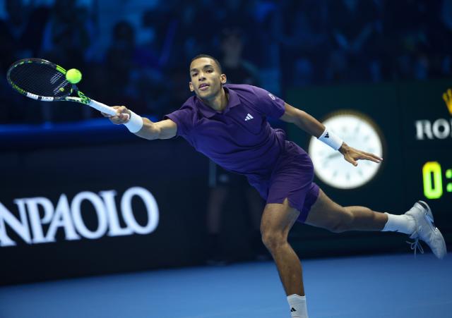 (251116) -- TURIN, Nov. 16, 2025 (Xinhua) -- Felix Auger-Aliassime returns a shot during the men's singles semifinal match between Carlos Alcaraz of Spain and Felix Auger-Aliassime of Canada at the ATP Finals tennis tournament in Turin, Italy, on Nov. 15, 2025. (Xinhua/Li Jing)