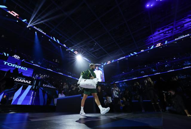 (251116) -- TURIN, Nov. 16, 2025 (Xinhua) -- Carlos Alcaraz enters the court before the men's singles semifinal match between Carlos Alcaraz of Spain and Felix Auger-Aliassime of Canada at the ATP Finals tennis tournament in Turin, Italy, on Nov. 15, 2025. (Xinhua/Li Jing)