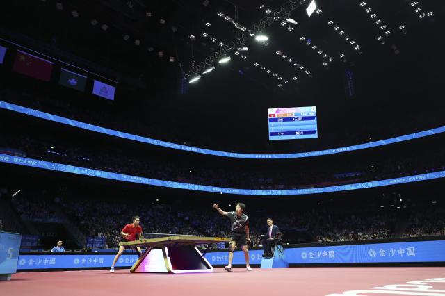 (251116) -- MACAO, Nov. 16, 2025 (Xinhua) -- Wang Chuqin (R) serves during the men's singles bronze medal match of table tennis between Wang Chuqin of Beijing and Yuan Licen of Liaoning at China's 15th National Games in Macao, south China, Nov. 16, 2025. (Xinhua/Liu Xu)