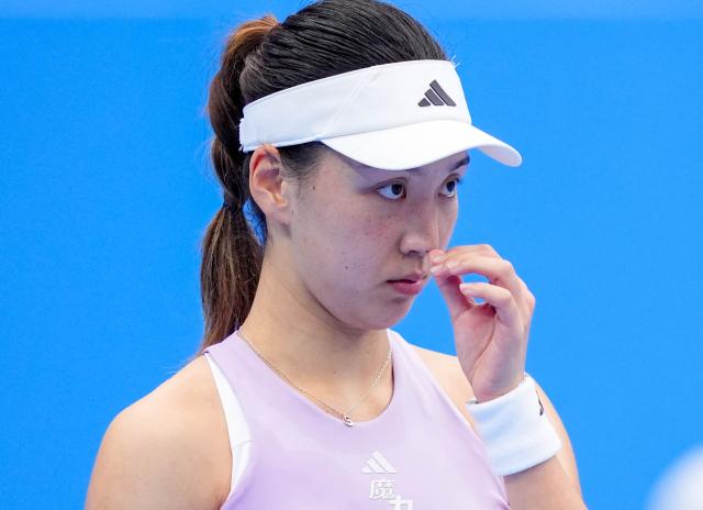 (251116) -- HENGQIN, Nov. 16, 2025 (Xinhua) -- Wang Xinyu reacts during the women's singles second round match of tennis between Wang Xinyu of Guangdong and Wang Xiaotong of Guizhou at China's 15th National Games in Hengqin, south China's Guangdong Province, Nov. 16, 2025. (Xinhua/Yan Linyun)