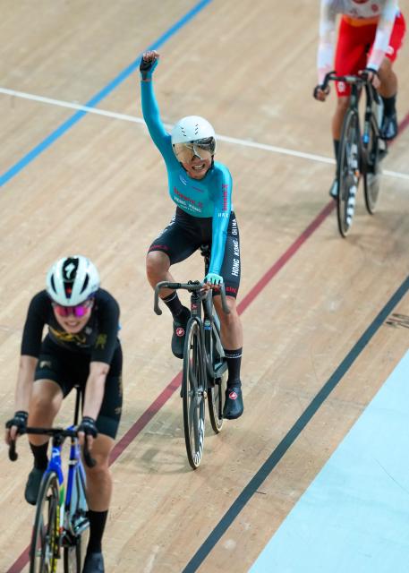 (251116) -- HONG KONG, Nov. 16, 2025 (Xinhua) -- Leung Wing Yee (C) of Hong Kong celebrates after the women's Madison final of cycling track at China's 15th National Games in Hong Kong, south China, Nov. 16, 2025. (Xinhua/Wu Lu)