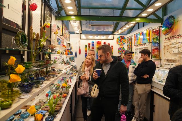 (251116) -- NEW YORK, Nov. 16, 2025 (Xinhua) -- People shop at a holiday market of the Winter Village at Bryant Park in New York, the United States, on Nov. 15, 2025. Featuring a holiday market, a skating rink and a food hall, the Winter Village is a popular winter holiday destination at Bryant Park. (Xinhua/Zhang Fengguo)