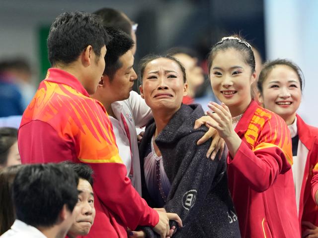 (251116) -- ZHAOQING, Nov. 16, 2025 (Xinhua) -- Deng Yalan (3rd R) of Jiangxi reacts after the artistic gymnastics women's vault final at China's 15th National Games in Zhaoqing, south China's Guangdong Province, Nov. 16, 2025. (Xinhua/Xu Bingjie)