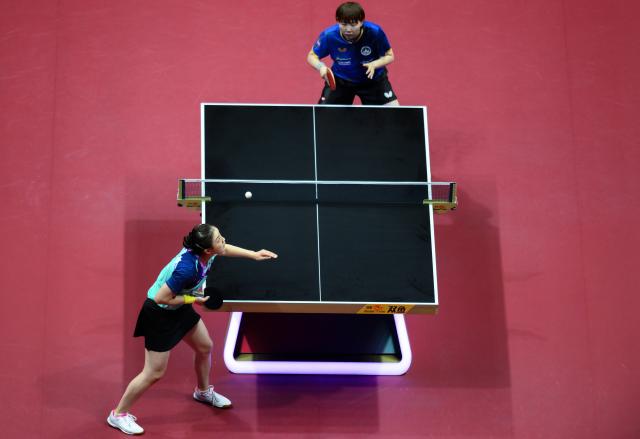 (251116) -- MACAO, Nov. 16, 2025 (Xinhua) -- Chen Meng (bottom) serves during the women's singles bronze medal match of table tennis between Zhu Yuling of Macao and Chen Meng of Shandong at China's 15th National Games in Macao, south China, Nov. 16, 2025. (Xinhua/Cheong Kam Ka)